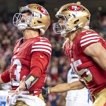December 30, 2024; Santa Clara, California, USA; San Francisco 49ers quarterback Brock Purdy (13) celebrates with tight end George Kittle (85) after scoring a touchdown against the Detroit Lions during the second quarter at Levi's Stadium. Mandatory Credit: Kyle Terada-Imagn Images