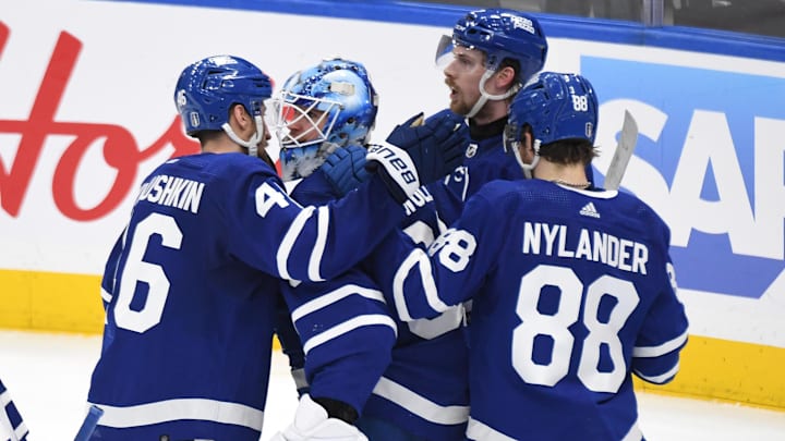 May 2, 2024; Toronto, Ontario, CAN;   Toronto Maple Leafs goalie Joseph Woll (60) celebrates with defensemen Ilya Lyubushkin (46), Simone Benoit (2) and forward William Nylander after a win over the Boston period in game six of the first round of the 2024 Stanley Cup Playoffs at Scotiabank Arena. Mandatory Credit: Dan Hamilton-Imagn Images