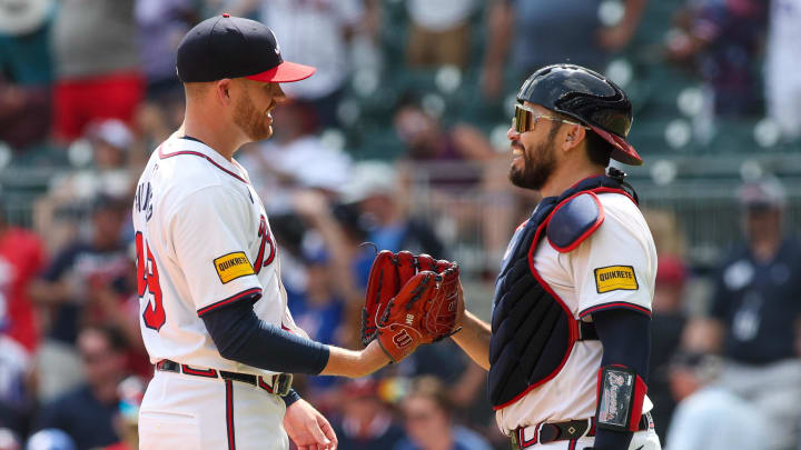 Atlanta Braves pitcher Aaron Bummer (49) and catcher Travis d'Arnaud.