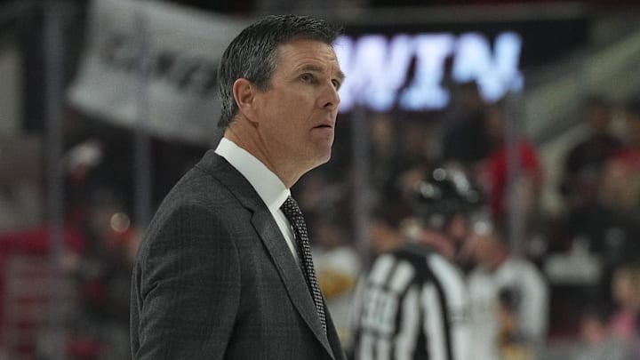 Jan 14, 2023; Raleigh, North Carolina, USA;  Pittsburgh Penguins head coach Mike Sullivan looks up after the game against the Carolina Hurricanes at PNC Arena. Mandatory Credit: James Guillory-Imagn Images