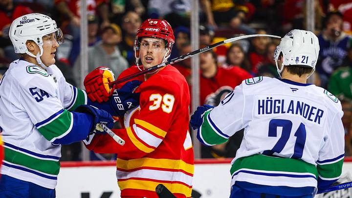 Mar 28, 2026; Calgary, Alberta, CAN; Calgary Flames center Tyson Gross (39) against the Vancouver Canucks during the second period at Scotiabank Saddledome. Mandatory Credit: Sergei Belski-Imagn Images