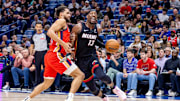 Apr 11, 2025; New Orleans, Louisiana, USA; Miami Heat center Bam Adebayo (13) dribbles against New Orleans Pelicans forward Jeremiah Robinson-Earl (50) during the first half at Smoothie King Center. Mandatory Credit: Stephen Lew-Imagn Images