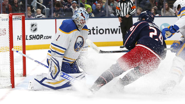 Jan 3, 2026; Columbus, Ohio, USA; Columbus Blue Jackets center Mathieu Olivier (24) scores a goal past Buffalo Sabres goalie Ukko-Pekka Luukkonen (1) during the second period at Nationwide Arena. Mandatory Credit: Russell LaBounty-Imagn Images