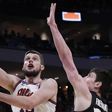 Mar 21, 2025; Milwaukee, WI, USA; Illinois center Tomislav Ivisic (13) attempts to score as Xavier forward Zach Freemantle goes for a block during the first half of their first round NCAA men’ s basketball tournament game at Fiserv Forum. Mandatory Credit: Jovanny Hernandez/USA Today Network via Imagn Images