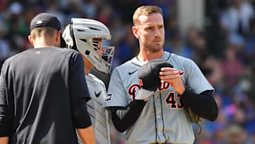 Aug 22, 2024; Chicago, Illinois, USA; Detroit Tigers relief pitcher Joey Wentz (right) reacts next to catcher Dillon Dingler (center) after giving up a two-run double to Chicago Cubs center fielder Pete Crow-Armstrong (not pictured) during the seventh inning at Wrigley Field. Mandatory Credit: Patrick Gorski-Imagn Images