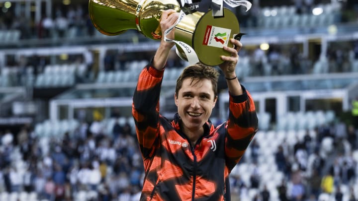 Federico Chiesa of Juventus FC parades with the recently...