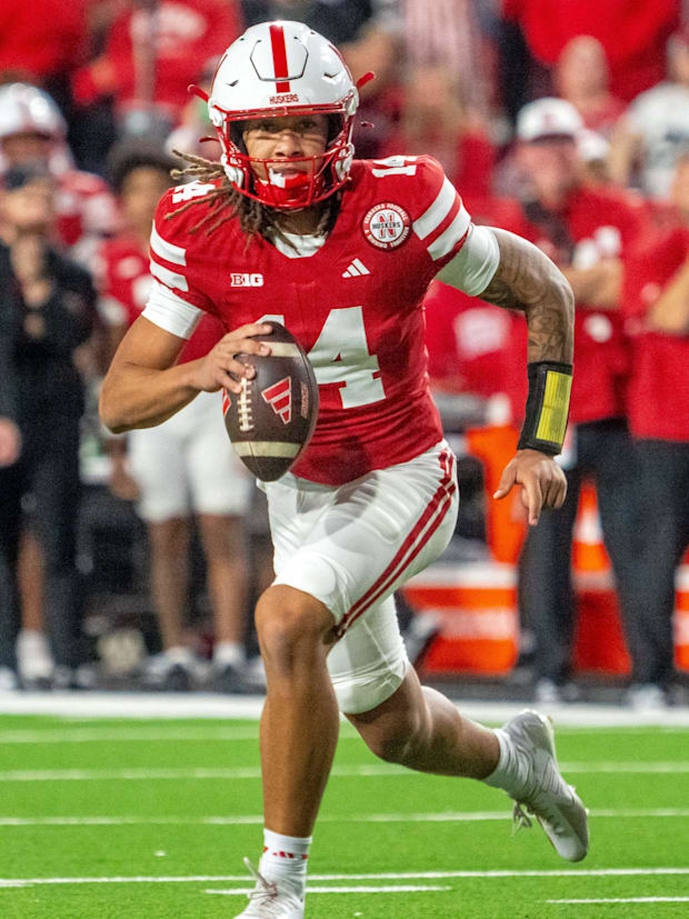 Nebraska Cornhuskers quarterback TJ Lateef scrambles against the Akron Zips.