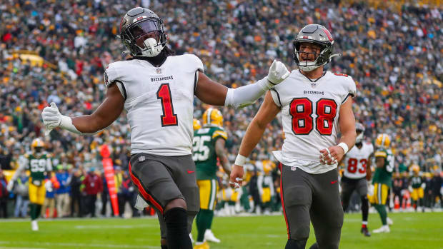 Tampa Bay Buccaneers running back Rachaad White (1) and tight end Cade Otton (88) celebrate after White scores a touchdown against the Green Bay Packers on Sunday, December 17, 2023, at Lambeau Field in Green Bay, Wis. Tampa Bay won the game, 34-20.