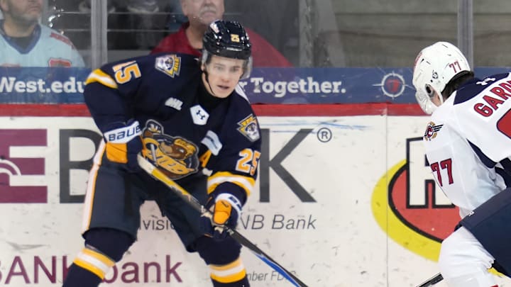 Erie Otters forward Michael Dec, left, competes during an OHL game against the Windsor Spitfires at Erie Insurance Arena in Erie on Jan. 16, 2026.