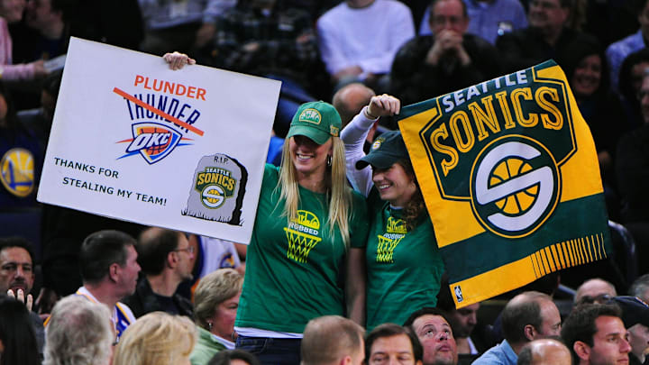 Seattle Sonics fans stand between plays during the second quarter between the Golden State Warriors and the Oklahoma City Thunder at ORACLE Arena in 2011. Seattle Sonics fans stand between plays during the second quarter between the Golden State Warriors and the Oklahoma City Thunder at ORACLE Arena in 2011.