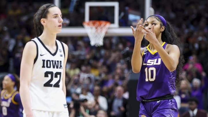 Apr 2, 2023; Dallas, TX, USA; LSU Lady Tigers forward Angel Reese (10) gestures towards Iowa Hawkeyes guard Caitlin Clark (22) after the final round of the Women's Final Four NCAA tournament at the American Airlines Center. Mandatory Credit: Kevin Jairaj-USA TODAY Sports