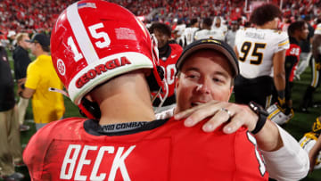 Georgia quarterback Carson Beck (15) speaks with Missouri head coach Eliah Drinkwitz after a NCAA college football game against Missouri in Athens, Ga., on Saturday, Nov. 4, 2023. Georgia won 30-21.