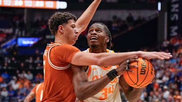 Texas forward Kadin Shedrick (5) pressures Tennessee forward Felix Okpara (34) during the first half of a Southeastern Conference tournament quarterfinal game at Bridgestone Arena.