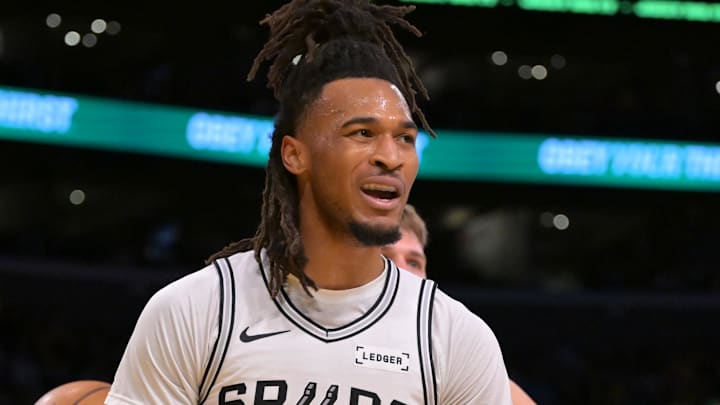 Dec 10, 2025; Los Angeles, California, USA;  San Antonio Spurs guard Stephon Castle (5) reacts after a basket and a foul called on Los Angeles Lakers guard Luka Doncic (77) during the first half at Crypto.com Arena. Mandatory Credit: Jayne Kamin-Oncea-Imagn Images
