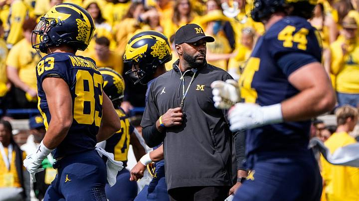 Michigan head coach Sherrone Moore, center, watches warmups before the No. 9 Wolverines' 31-12 loss to No. 3 Texas at Michigan Stadium in Ann Arbor on Saturday, Sept. 7, 2024.