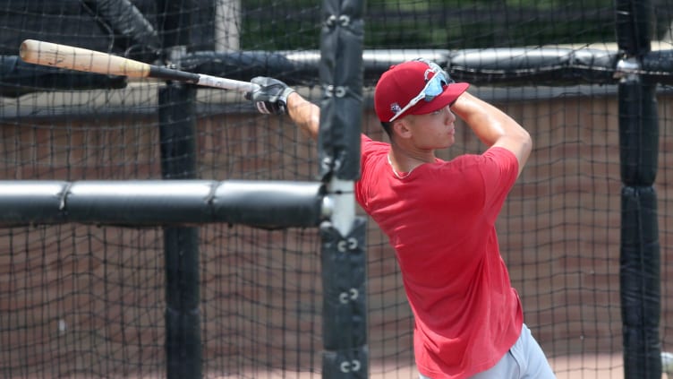 Cincinnati Reds outfielder Stuart Fairchild (84) follows through on a swing.