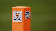 Nov 5, 2022; Charlottesville, Virginia, USA; A detailed view of the Virginia Cavaliers and ACC logos on the end zone pylon used during the game between the Virginia Cavaliers and the North Carolina Tar Heels at Scott Stadium. Mandatory Credit: Scott Taetsch-Imagn Images