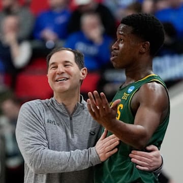 Mar 21, 2025; Raleigh, NC, USA; Baylor Bears head coach Scott Drew speaks with guard VJ Edgecombe (7) during the first half in the first round of the NCAA Tournament at Lenovo Center. Mandatory Credit: Bob Donnan-Imagn Images