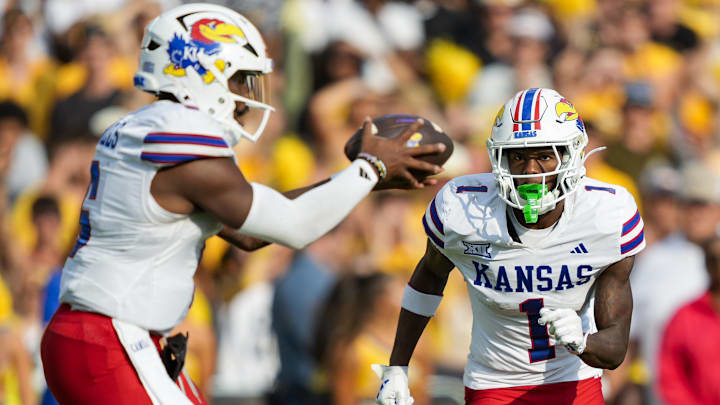 Sep 6, 2025; Columbia, Missouri, USA; Kansas Jayhawks wide receiver Emmanuel Henderson Jr. (1) runs during the second half against the Missouri Tigers at Faurot Field at Memorial Stadium. Mandatory Credit: Jay Biggerstaff-Imagn Images