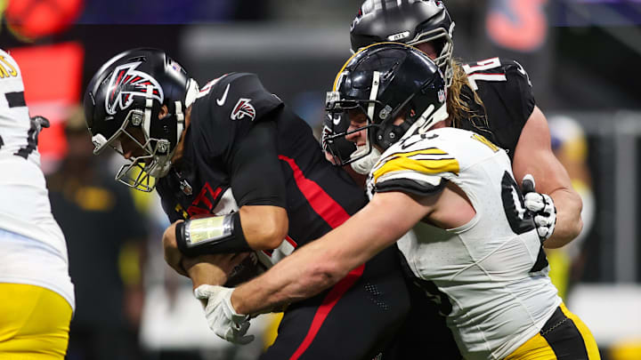 Sep 8, 2024; Atlanta, Georgia, USA; Pittsburgh Steelers linebacker T.J. Watt (90) sacks Atlanta Falcons quarterback Kirk Cousins (18) in the fourth quarter at Mercedes-Benz Stadium. Mandatory Credit: Brett Davis-Imagn Images