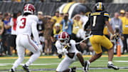 Oct 11, 2025; Columbia, Missouri, USA;  Alabama Crimson Tide defensive back Dijon Lee Jr. (5) intercepts a pass intended for Missouri Tigers wide receiver Donovan Olugbode (1) during the fourth quarter at Faurot Field at Memorial Stadium. Mandatory Credit: Reese Strickland-Imagn Images