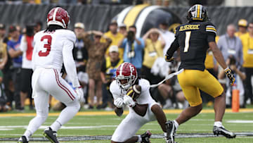 Oct 11, 2025; Columbia, Missouri, USA;  Alabama Crimson Tide defensive back Dijon Lee Jr. (5) intercepts a pass intended for Missouri Tigers wide receiver Donovan Olugbode (1) during the fourth quarter at Faurot Field at Memorial Stadium. Mandatory Credit: Reese Strickland-Imagn Images