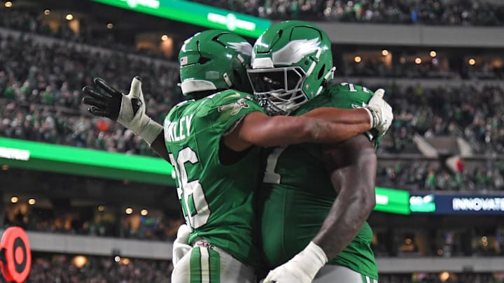 Nov 3, 2024; Philadelphia, Pennsylvania, USA; Philadelphia Eagles running back Saquon Barkley (26) celebrates his touchdown run with offensive tackle Mekhi Becton (77) during the second quarter against the Jacksonville Jaguars at Lincoln Financial Field. Mandatory Credit: Eric Hartline-Imagn Images