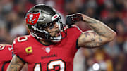 Tampa Bay Buccaneers wide receiver Mike Evans celebrates after a touchdown catch with tight end Cade Otton