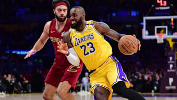 Dec 31, 2024; Los Angeles, California, USA; Los Angeles Lakers forward LeBron James (23) moves to the basket against Cleveland Cavaliers guard Max Strus (1) during the first half at Crypto.com Arena. Mandatory Credit: Gary A. Vasquez-Imagn Images
