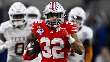 Jan 10, 2025; Arlington, TX, USA;  Ohio State Buckeyes running back TreVeyon Henderson (32) scores a touchdown on a pass from quarterback Will Howard (not pictured) during the second quarter at AT&T Stadium. Mandatory Credit: Jerome Miron-Imagn Images