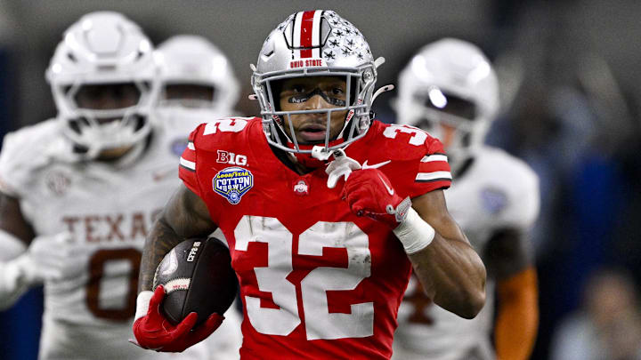 Jan 10, 2025; Arlington, TX, USA;  Ohio State Buckeyes running back TreVeyon Henderson (32) scores a touchdown on a pass from quarterback Will Howard (not pictured) during the second quarter at AT&T Stadium. Mandatory Credit: Jerome Miron-Imagn Images