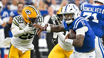 Aug 16, 2025; Indianapolis, Indiana, USA; Indianapolis Colts quarterback Anthony Richardson Sr. (5) runs the ball against Green Bay Packers linebacker Isaiah Simmons (28) during the first half at Lucas Oil Stadium. Mandatory Credit: Robert Goddin-Imagn Images