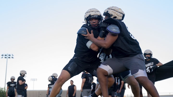 Franklin’s Justin Morales, left, works on drills with his teammates at football practice on Wednesday morning, Aug. 14, 2024.