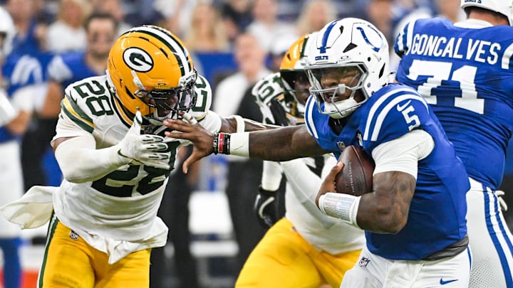 Aug 16, 2025; Indianapolis, Indiana, USA; Indianapolis Colts quarterback Anthony Richardson Sr. (5) runs the ball against Green Bay Packers linebacker Isaiah Simmons (28) during the first half at Lucas Oil Stadium. Mandatory Credit: Robert Goddin-Imagn Images