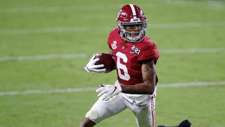 Jan. 11, 2021; Miami Gardens, Florida, USA; Alabama Crimson Tide wide receiver DeVonta Smith (6) runs for a 5-yard touchdown during the second quarter of the College Football Playoff National Championship against the Ohio State Buckeyes at Hard Rock Stadium in Miami Gardens, Fla.