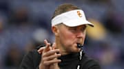 Nov 2, 2024; Seattle, Washington, USA; USC Trojans head coach Lincoln Riley watches pregame warmups against the Washington Huskies at Alaska Airlines Field at Husky Stadium. Mandatory Credit: Joe Nicholson-Imagn Images