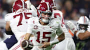 Nov 29, 2025; Auburn, Alabama, USA; Alabama Crimson Tide quarterback Ty Simpson (15) runs with the ball during the first half against the Auburn Tigers at Jordan-Hare Stadium. Mandatory Credit: John Reed-Imagn Images