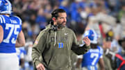 Nov 15, 2025; Durham, North Carolina, USA;  Duke Blue Devils head coach Manny Diaz reacts during the third quarter against the Virginia Cavaliers at Wallace Wade Stadium. Mandatory Credit: Zachary Taft-Imagn Images