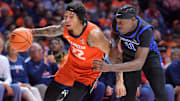 Nov 4, 2024; Champaign, Illinois, USA;  Illinois Fighting Illini guard Tre White (22) drives the ball as Eastern Illinois Panthers guard Malik Olafioye (11) guards him during the first half at State Farm Center. Mandatory Credit: Ron Johnson-Imagn Images