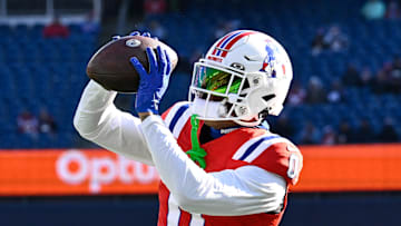 Dec 1, 2024; Foxborough, Massachusetts, USA; New England Patriots cornerback Christian Gonzalez (0) warms up before a game against the Indianapolis Colts at Gillette Stadium. Mandatory Credit: Eric Canha-Imagn Images