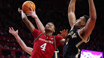 Purdue Boilermakers forward Caleb Furst (1) blocks a shot by Rutgers Scarlet Knights guard Ace Bailey (4) 