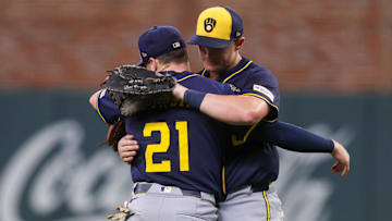 Aug 5, 2025; Atlanta, Georgia, USA; Milwaukee Brewers third baseman Caleb Durbin (21) and first baseman Andrew Vaughn (28) celebrate after a victory over the Atlanta Braves at Truist Park. Mandatory Credit: Brett Davis-Imagn Images