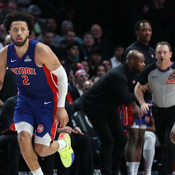 Mar 9, 2025; Portland, Oregon, USA;  Detroit Pistons guard Cade Cunningham (2) brings the ball up the court past Portland Trail Blazers forward Jerami Grant (9) in the second half at Moda Center. Mandatory Credit: Jaime Valdez-Imagn Images