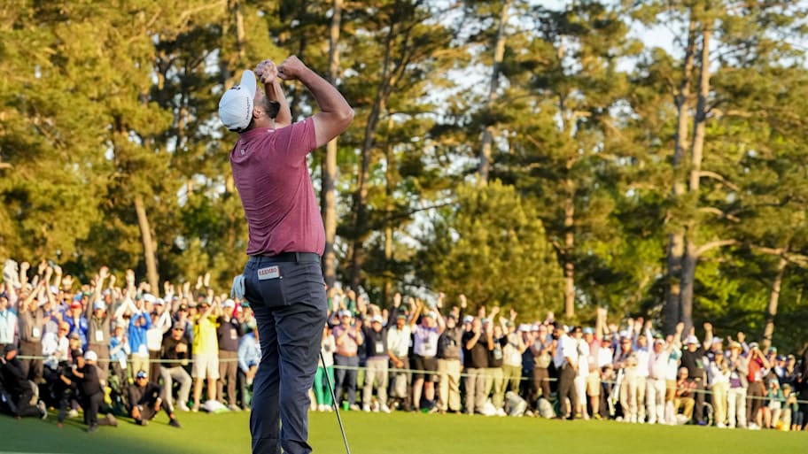 Jon Rahm reacts on the 18th green after winning The Masters golf tournament