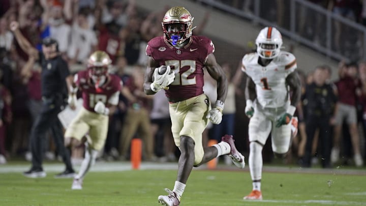 Oct 4, 2025; Tallahassee, Florida, USA; Florida State Seminoles running back Ousmane Kromah (32) runs during the first half against the Miami Hurricanes at Doak S. Campbell Stadium. Mandatory Credit: Melina Myers-Imagn Images
