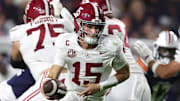 Alabama quarterback Ty Simpson runs with the ball in the Crimson Tide’s win over Auburn to secure their spot in the SEC title game.