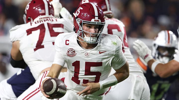 Alabama quarterback Ty Simpson runs with the ball in the Crimson Tide’s win over Auburn to secure their spot in the SEC title game.