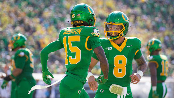 Oregon Ducks quarterback Dillon Gabriel and Oregon Ducks wide receiver Tez Johnson celebrate a touchdown by Johnson as the Oregon Ducks host the Idaho Vandals Saturday, Aug. 31, 2024 at Autzen Stadium in Eugene, Ore.