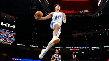Jalen Johnson #1 of the Atlanta Hawks breaks away for a dunk against the Dallas Mavericks.