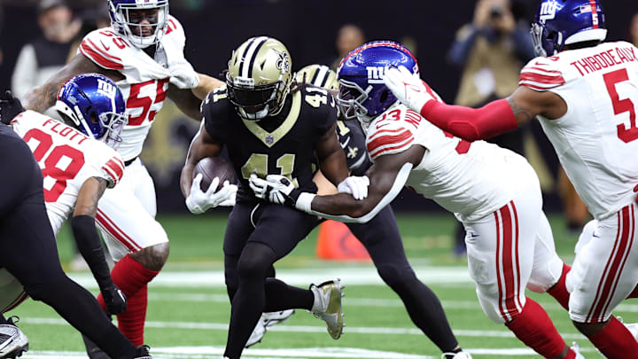 Dec 17, 2023; New Orleans, Louisiana, USA; New Orleans Saints running back Alvin Kamara (41) runs the ball while defended by New York Giants defensive tackle Rakeem Nunez-Roches (93) during the first half at Caesars Superdome. Dec 17, 2023; New Orleans, Louisiana, USA; New Orleans Saints running back Alvin Kamara (41) runs the ball while defended by New York Giants defensive tackle Rakeem Nunez-Roches (93) during the first half at Caesars Superdome.